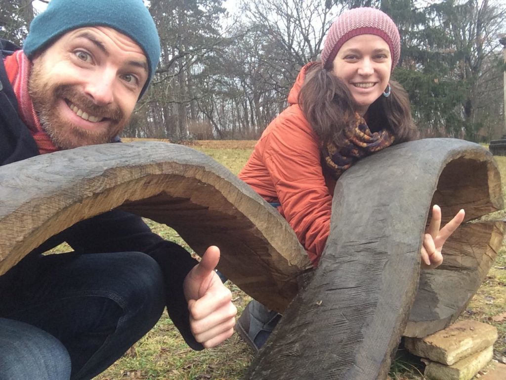 Melinda & Mischa posing with infinity sculpture